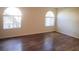 Neutral bedroom with hardwood floors and large windows allowing natural light at 9325 W Desert Inn Rd # 110, Las Vegas, NV 89117