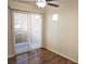 Bedroom with wood-look floors and patio access via sliding glass door at 9325 W Desert Inn Rd # 110, Las Vegas, NV 89117