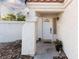 Inviting entryway with a welcoming front door and decorative rock landscaping at 9520 Wooden Pier Way, Las Vegas, NV 89117