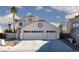 Home featuring a three-car garage and beautiful detailing under sunny skies at 9520 Wooden Pier Way, Las Vegas, NV 89117