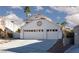 Home features a three-car garage, and a lovely desert landscaped yard at 9520 Wooden Pier Way, Las Vegas, NV 89117
