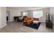 Open-concept living room featuring modern furniture and updated flooring at 9520 Wooden Pier Way, Las Vegas, NV 89117