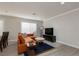 Comfortable living room showcases sleek furnishings and recessed lighting at 9520 Wooden Pier Way, Las Vegas, NV 89117