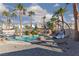 Relax in the backyard by the pool with a tanning ledge and comfortable, shaded lounge chair at 9520 Wooden Pier Way, Las Vegas, NV 89117