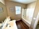Cozy bathroom with a shower over tub and hardwood floor at 9792 Cordova Vista Ct, Las Vegas, NV 89183