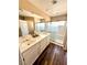 Bathroom with dual sinks, modern fixtures, and glass enclosed shower at 9792 Cordova Vista Ct, Las Vegas, NV 89183