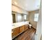 Bathroom featuring dual vanity, wood flooring, and great lighting at 9792 Cordova Vista Ct, Las Vegas, NV 89183