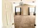 Neutral bedroom featuring a modern light fixture, carpet flooring, and dual windows at 9792 Cordova Vista Ct, Las Vegas, NV 89183