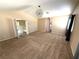 Neutral bedroom featuring a modern light fixture, carpet flooring, and open doorway at 9792 Cordova Vista Ct, Las Vegas, NV 89183