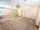 Neutral bedroom showcasing a modern light fixture, carpet flooring, and a window at 9792 Cordova Vista Ct, Las Vegas, NV 89183