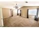 Large bedroom featuring carpet, a decorative chandelier, and two windows at 9792 Cordova Vista Ct, Las Vegas, NV 89183