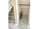 Walk-in closet with built-in shelving and tile flooring, adjacent to the stairs at 9792 Cordova Vista Ct, Las Vegas, NV 89183