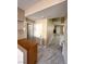 Bright entryway with tiled floors, neutral walls, decorative shelves, and a view into the main living space at 9792 Cordova Vista Ct, Las Vegas, NV 89183