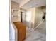 Entryway with decorative shelving, white doors, tile floor and neutral paint at 9792 Cordova Vista Ct, Las Vegas, NV 89183