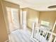 Bright hallway with elegant light fixture and staircase at 9792 Cordova Vista Ct, Las Vegas, NV 89183
