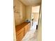 Hallway with an artistic message, cabinetry and a view of the modern kitchen at 9792 Cordova Vista Ct, Las Vegas, NV 89183