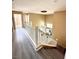 Spacious upper level hallway with vinyl floors and grand chandelier view at 9792 Cordova Vista Ct, Las Vegas, NV 89183