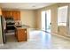 Bright kitchen featuring stainless steel appliances, granite countertops, and tile flooring at 9792 Cordova Vista Ct, Las Vegas, NV 89183