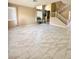 Bright living room with high ceilings, modern floors, and a staircase at 9792 Cordova Vista Ct, Las Vegas, NV 89183