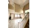 Bright living room with high ceilings, modern floors, a staircase, large chandelier and large windows at 9792 Cordova Vista Ct, Las Vegas, NV 89183