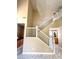 Inviting staircase with a large chandelier, bright lighting, and open floor plan at 9792 Cordova Vista Ct, Las Vegas, NV 89183