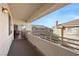 View from the balcony showcasing the fireplace and wood flooring visible through the sliding glass door at 9901 Trailwood Dr # 2144, Las Vegas, NV 89134
