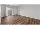 Bright bedroom featuring wood floors and a door leading to the patio at 9901 Trailwood Dr # 2144, Las Vegas, NV 89134