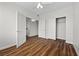 Bedroom featuring wood floors, closet space, and ceiling fan at 9901 Trailwood Dr # 2144, Las Vegas, NV 89134