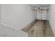 A standard garage with a functional garage door, with a concrete floor, perfect for parking and storage at 9901 Trailwood Dr # 2144, Las Vegas, NV 89134