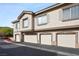 Townhome garages highlighting multiple private parking spaces and well-kept exterior at 9901 Trailwood Dr # 2144, Las Vegas, NV 89134