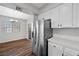 Bright dining area and kitchen with stainless steel appliances and white cabinets at 9901 Trailwood Dr # 2144, Las Vegas, NV 89134