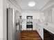 Bright kitchen features stainless steel appliances, white cabinetry, and sleek countertops at 9901 Trailwood Dr # 2144, Las Vegas, NV 89134