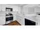 Modern kitchen featuring stainless steel appliances, white cabinetry, and quartz countertops at 9901 Trailwood Dr # 2144, Las Vegas, NV 89134