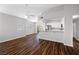 Well-lit living area offering stylish ceiling fan and views of the kitchen with breakfast bar at 9901 Trailwood Dr # 2144, Las Vegas, NV 89134