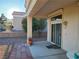 Cozy covered patio with brick accents and mature trees offer a relaxing outdoor space at 9937 Villa Ridge Dr, Las Vegas, NV 89134