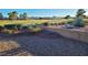 Backyard area showing a brick retaining wall and view of the golf course at 9937 Villa Ridge Dr, Las Vegas, NV 89134