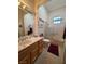 Neutral bathroom featuring a vanity with a sink and a shower-tub combination with glass doors at 9937 Villa Ridge Dr, Las Vegas, NV 89134