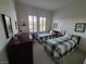 Comfortable bedroom with two twin beds, natural light, and ample space for relaxation at 9937 Villa Ridge Dr, Las Vegas, NV 89134