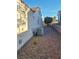 Exterior shot with rock landscaping and stone pavers leading to AC unit on the side of the home at 9937 Villa Ridge Dr, Las Vegas, NV 89134