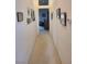 Bright hallway with decorative wall art leading into a cozy living space at 9937 Villa Ridge Dr, Las Vegas, NV 89134