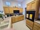 Bright kitchen with light cabinets, modern appliances, and plenty of counter space for cooking at 9937 Villa Ridge Dr, Las Vegas, NV 89134