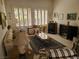 Inviting living room with large windows, plantation shutters, and comfortable furnishings at 9937 Villa Ridge Dr, Las Vegas, NV 89134