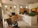 Inviting living space with kitchenette, breakfast bar and casual seating at 9937 Villa Ridge Dr, Las Vegas, NV 89134