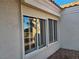 Exterior view of windows with shutters, showcasing natural light and neutral stucco at 9937 Villa Ridge Dr, Las Vegas, NV 89134
