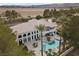 Breathtaking aerial view showcasing a large backyard, lush greenery, and a pristine pool at 10 Innisbrook Ave, Las Vegas, NV 89113