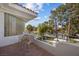 Charming balcony with seating overlooks a lush landscape, offering a relaxing outdoor retreat at 10 Innisbrook Ave, Las Vegas, NV 89113