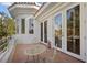 Outdoor balcony with a patio furniture set with trees and foliage adding privacy and charm at 10 Innisbrook Ave, Las Vegas, NV 89113