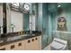 Elegant bathroom with a decorative wall mounted horse statue and vanity with granite counter at 10 Innisbrook Ave, Las Vegas, NV 89113