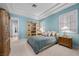 Comfortable bedroom with built-in shelving, tray ceiling, bedside tables and lamps at 10 Innisbrook Ave, Las Vegas, NV 89113