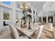 Bright dining room featuring a chandelier, high windows, marble floors and table at 10 Innisbrook Ave, Las Vegas, NV 89113